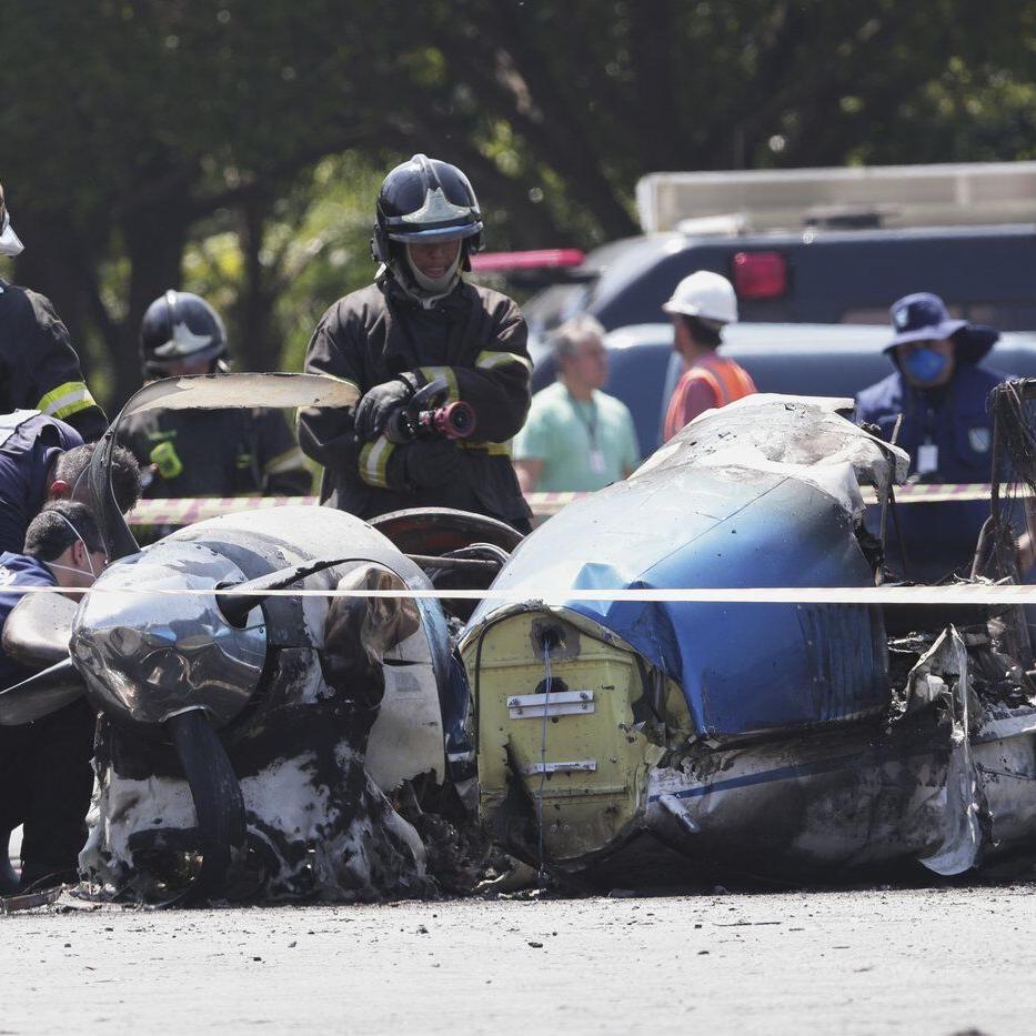 A small plane slams into a Brazilian street and kills 2 people on board